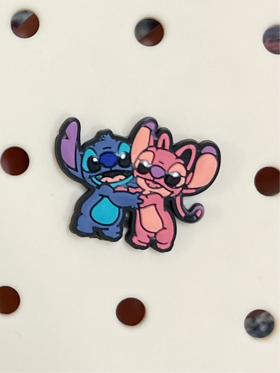 Stitch and angel charm