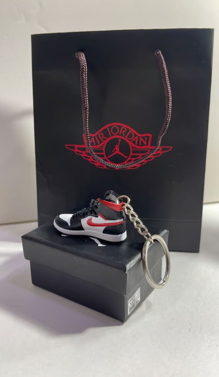 Red and black mini nike shoe keychain