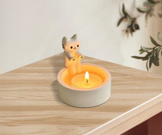 Cat Warming its paws candle holder