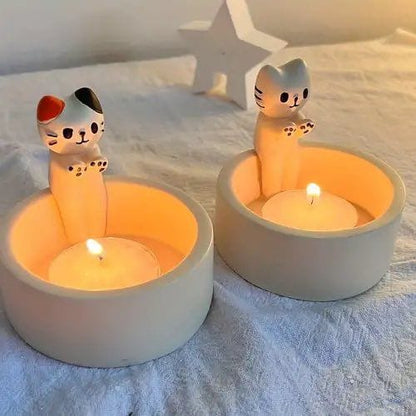 Cat Warming its paws candle holder