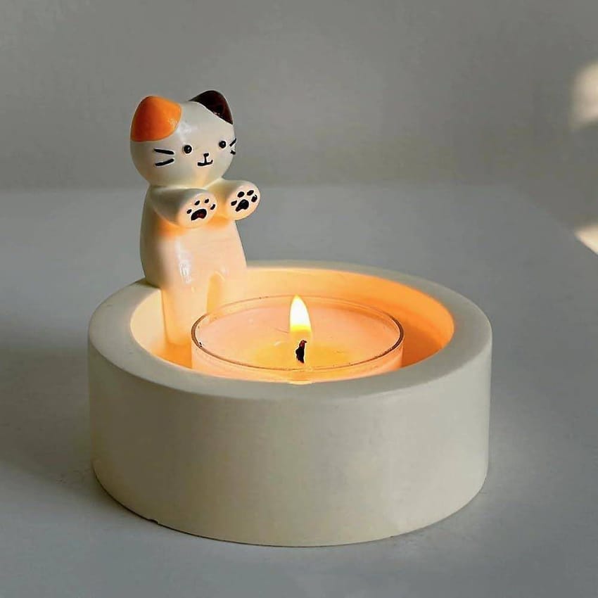 Cat Warming its paws candle holder